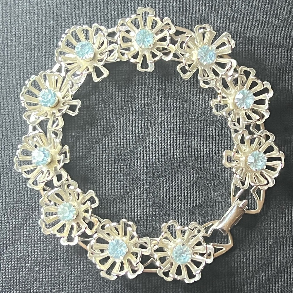 “Coro” 7” bracelet: silver tone flowers with light blue center rhinestones
